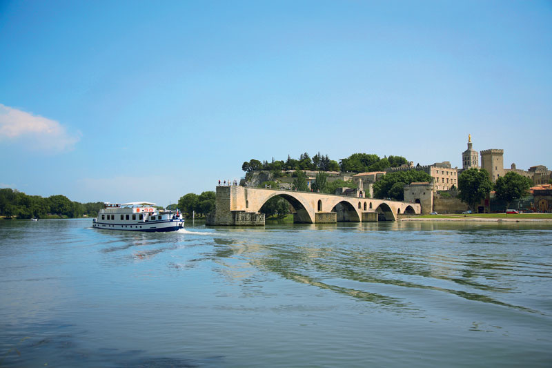 Napoleon sails past the Avignon Bridge.
