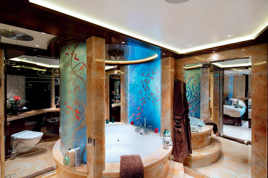 Bathrooms in the master suite. The bathroom pedestal is made of onyx and the glass panels on the walls are handmade masterpieces.