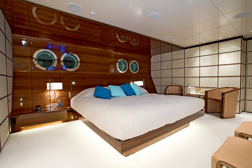 Furniture VIP apartments floats in the light of built-in lighting. The walls of white leather are shaded with mahogany wall panels.