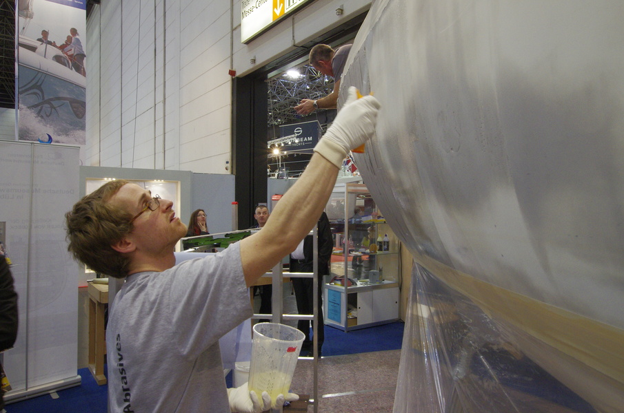 Right in the pavilion workers painted, drilled and glued boats...