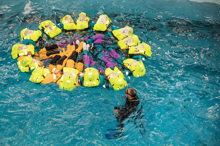 VOR participants are practicing methods of forming a figure of people in life jackets. Ainhoa Sanchez, Volvo Ocean Race.