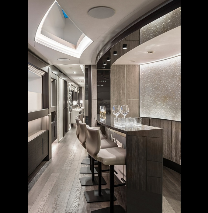 In the corridorway connecting the two parts of the salon, there is a small bar - with a stand and high chairs.