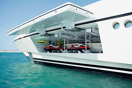 A pair of aqua bikes are placed on the lower deck, in the bow.