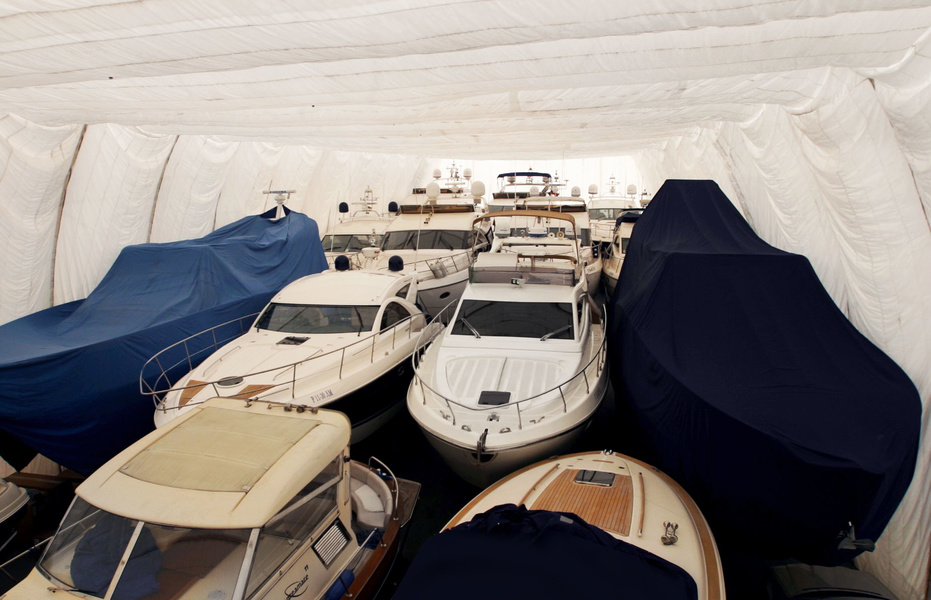 Winter storage boats in the warm boathouse of the Burevestnik Group