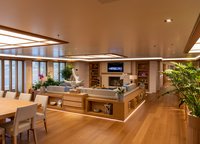 Fireplace, large U-shaped sofa, dining area - the main salon of Flying Fox is more like a cozy villa on the seashore than «a» boat cabin. 