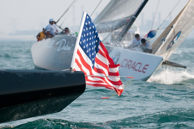 The American flag boat is in the lead.