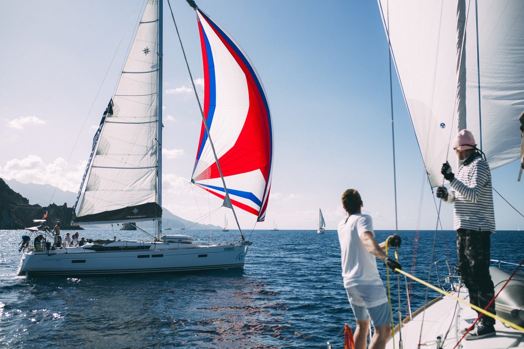 Yachtsmen have their own fashion - it's a sin not to show off your spinnaker if you get such a bright sail.