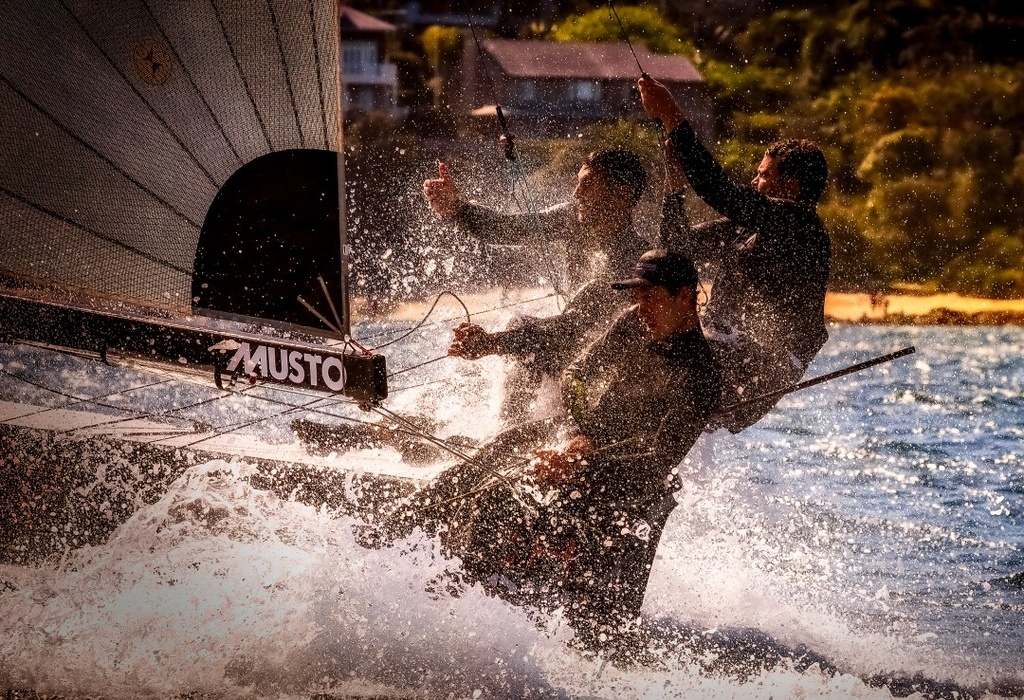 Harry Price, Paul MacKenzie and Matt Stenta on the 4.9-meter «Skeefer» Sutech during the first Point Score race in Sydney Bay. «I've always wanted to try to take a picture of what it's like to be on the Scythian. Specifically that day it was wet and crazy»,