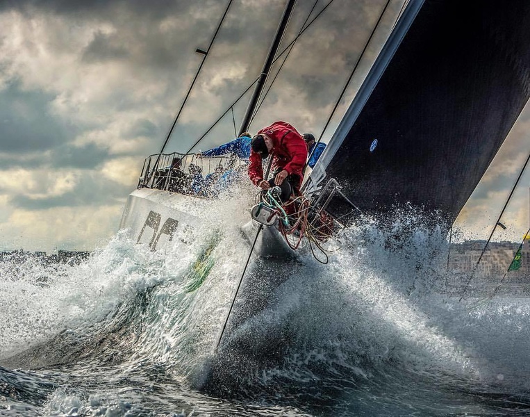 First boat at the finish of the Rolex Middle Sea Race 2017 -- Rambler 88 - during the race