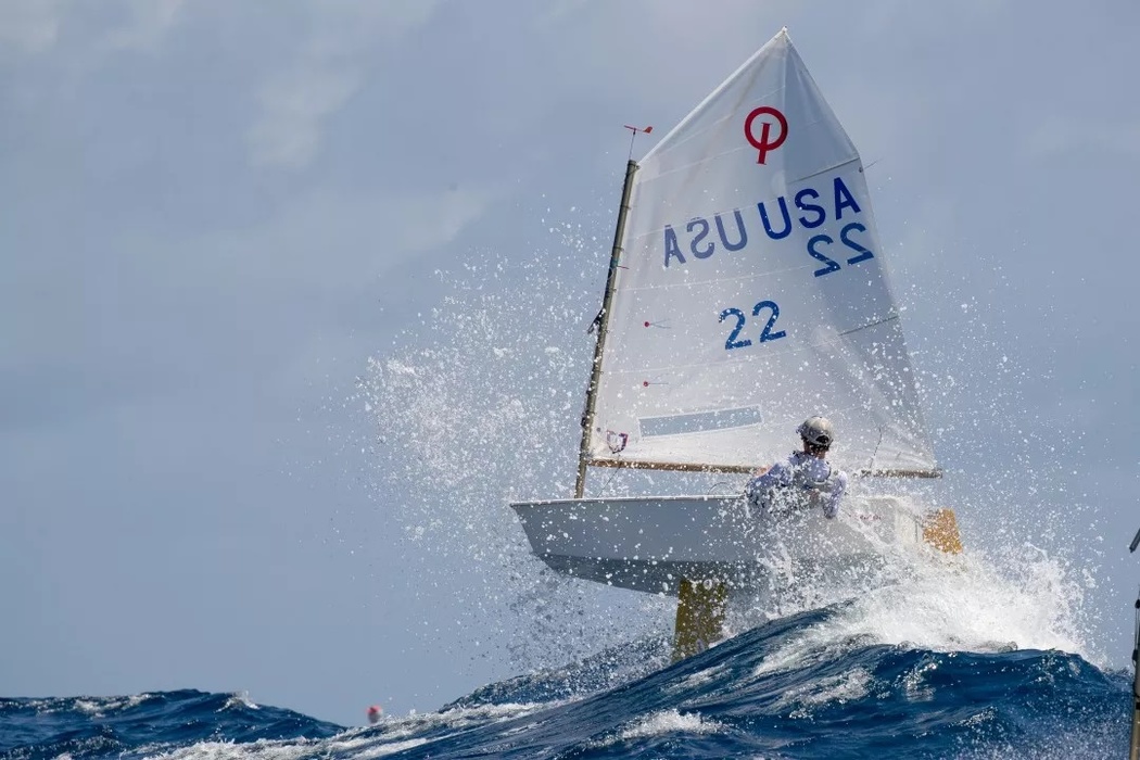 American Tommy Sitzmann confronts waves at his «Optimist» Regatta during the St Thomas International Optimist Regatta in the Virgin Islands in the Caribbean Sea.
