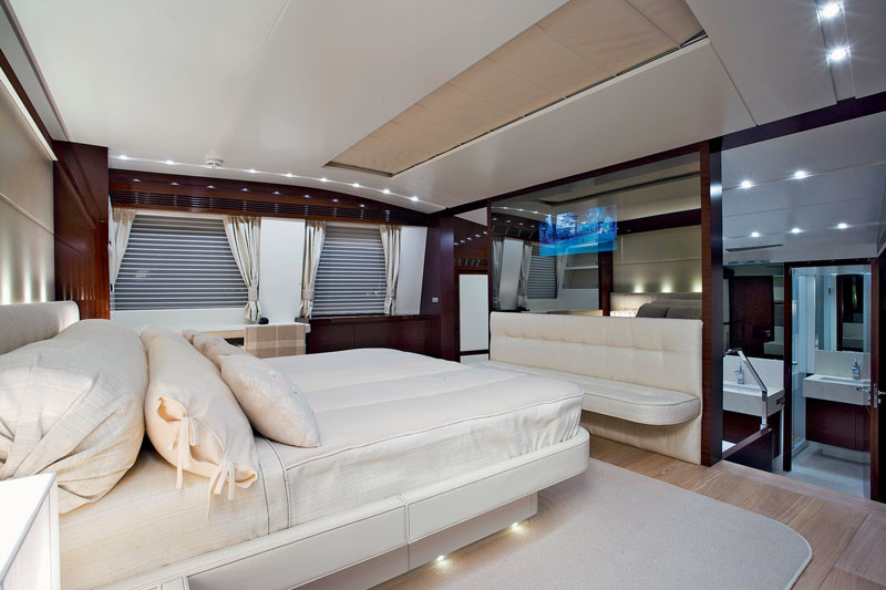 In the master suite, automatic curtains on the ceiling open the skylight and the TV is hidden in the mirror.
