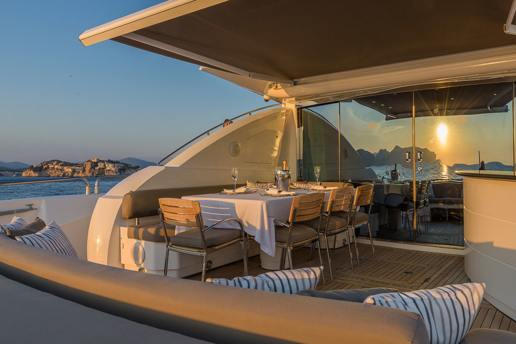 Aft of the main deck is an alfresco area with another dining area and a bar. This area can be covered from above by an electrically operated elbow cassette awning. 