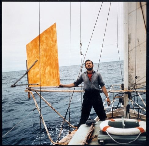Suhaili at Sea: R. Knox-Johnston keeps watch to the wind steering wheel.