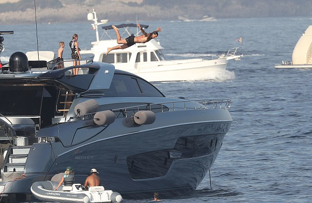 Football player with family on a charter boat