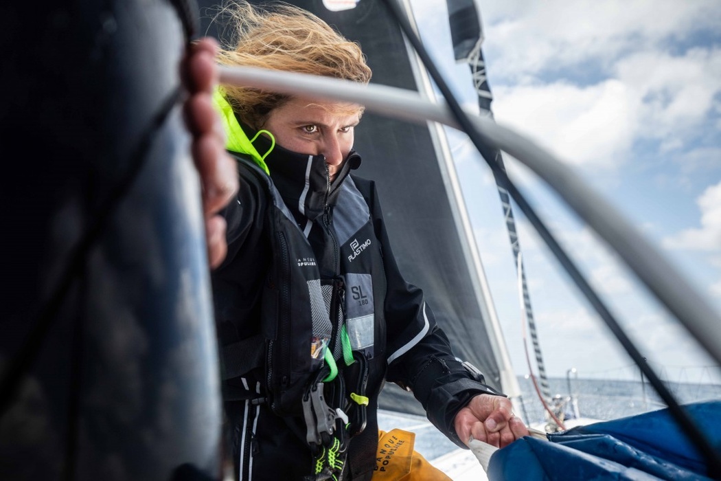 «June 2020, a few days before the end of quarantine. Clarisse Crémer (itBoat note) has returned aboard her Imoca 60 to train alone in the Bay of Biscay. The weather conditions for resuming offshore crossings are harsh, but she is able to steer her boat very well. This photo shows Clarissa on the bow while laying a heavy sail after a gybe turn. To me, this photo is a demonstration of just how much dedication and concentration a yachtsman needs. Behind Clarissa's pretty face there is a real fighter. She is now ready to sail solo around the world»,