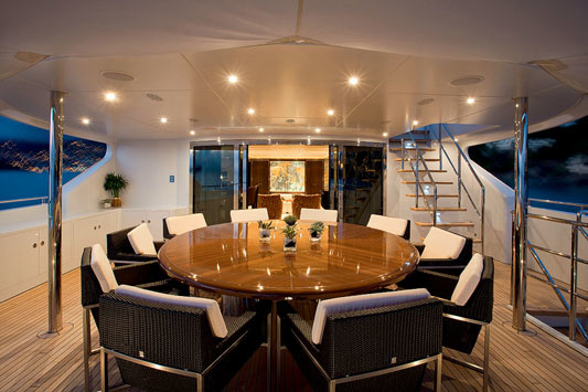 The outdoor dining area is located at main deck level.