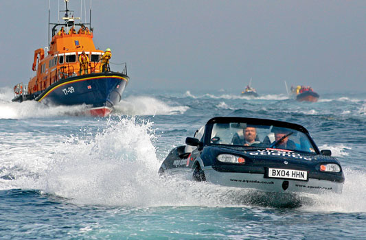 March 2004. Richard Branson crossing the English Channel on the amphibious Gibbs Aquada.  Designer Neil Jenkins sits with Branson on the amphibian.
