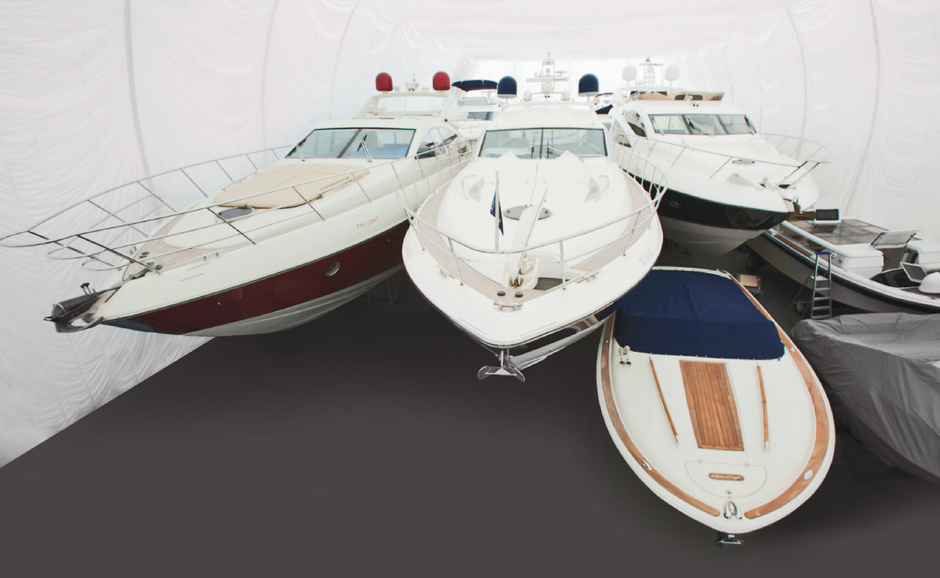 Winter storage boats in the warm boathouse of the Burevestnik Group 